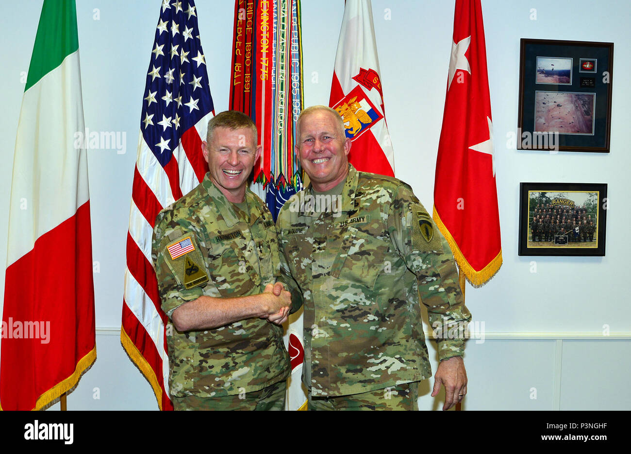 MG Timothy McGuire visited Caserma Del Din, Vicenza, Italy  From left , Maj. Gen. Joseph P. Harrington, U.S. Army Africa Commanding General and Maj. Gen. Timothy McGuire, Deputy Commanding General, US Army Europe, pose for a photo in the USARAF Commander's office at Caserma Ederle in Vicenza, Italy, July 11, 2016. (Photo by Visual Information Specialist  Massimo Bovo/released) Stock Photo