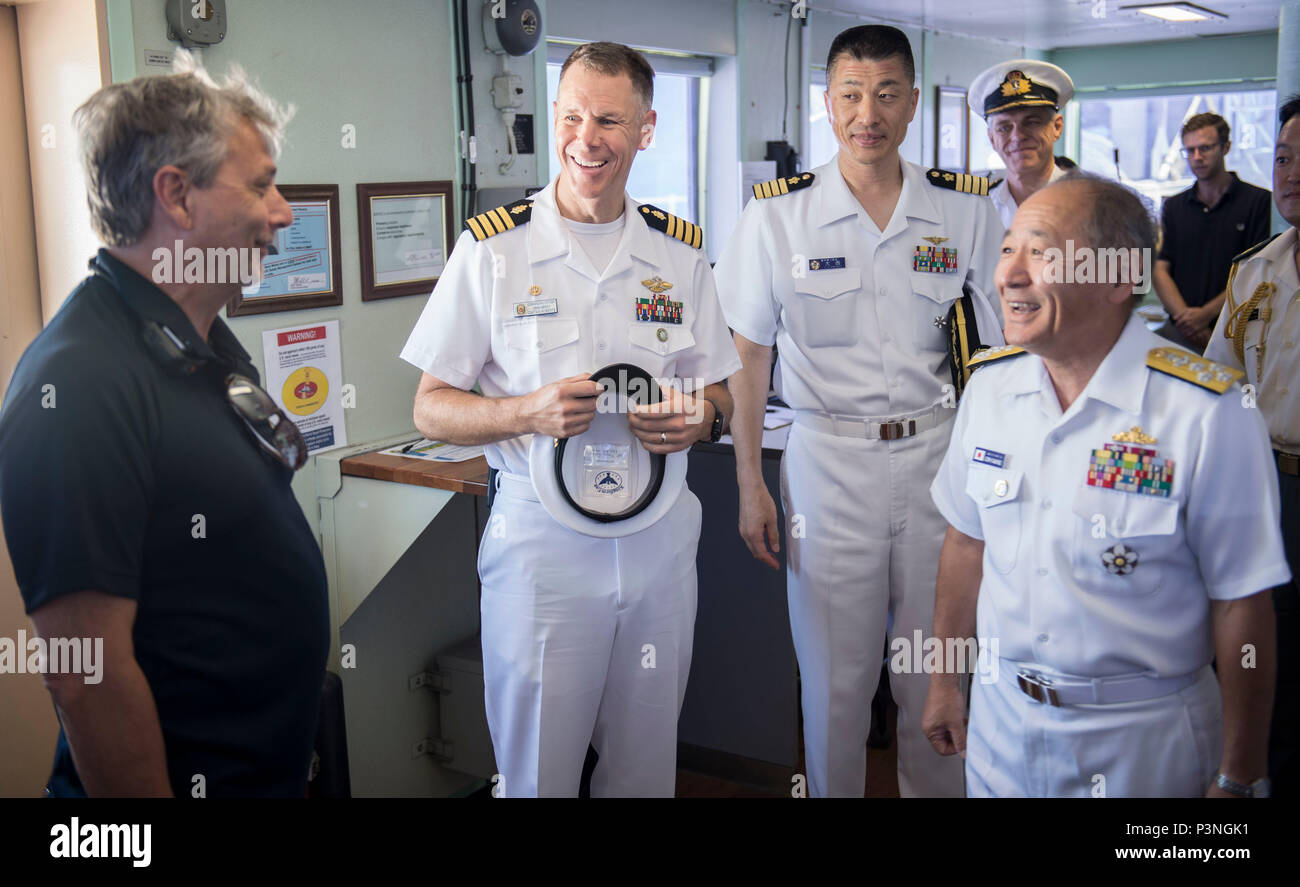 160717-N-QW941-072 DA NANG, Vietnam (July 17, 2016) Admiral Katsutoshi Kawano (right), chief of staff of the Joint Staff, Japanese Self-Defense Force, meets Thomas Giudice (left), Ship's Master, USNS Mercy (T-AH 19) during a tour of the ship. Kawano visited Mercy and JS Shimokita (LST-4002), which are both in Da Nang for Pacific Partnership 2016. Partner nations are working side-by-side with local military and non-government organizations to conduct cooperative health engagements, community relation events and subject matter expert exchanges to better prepare for natural disaster or crisis. (U Stock Photo