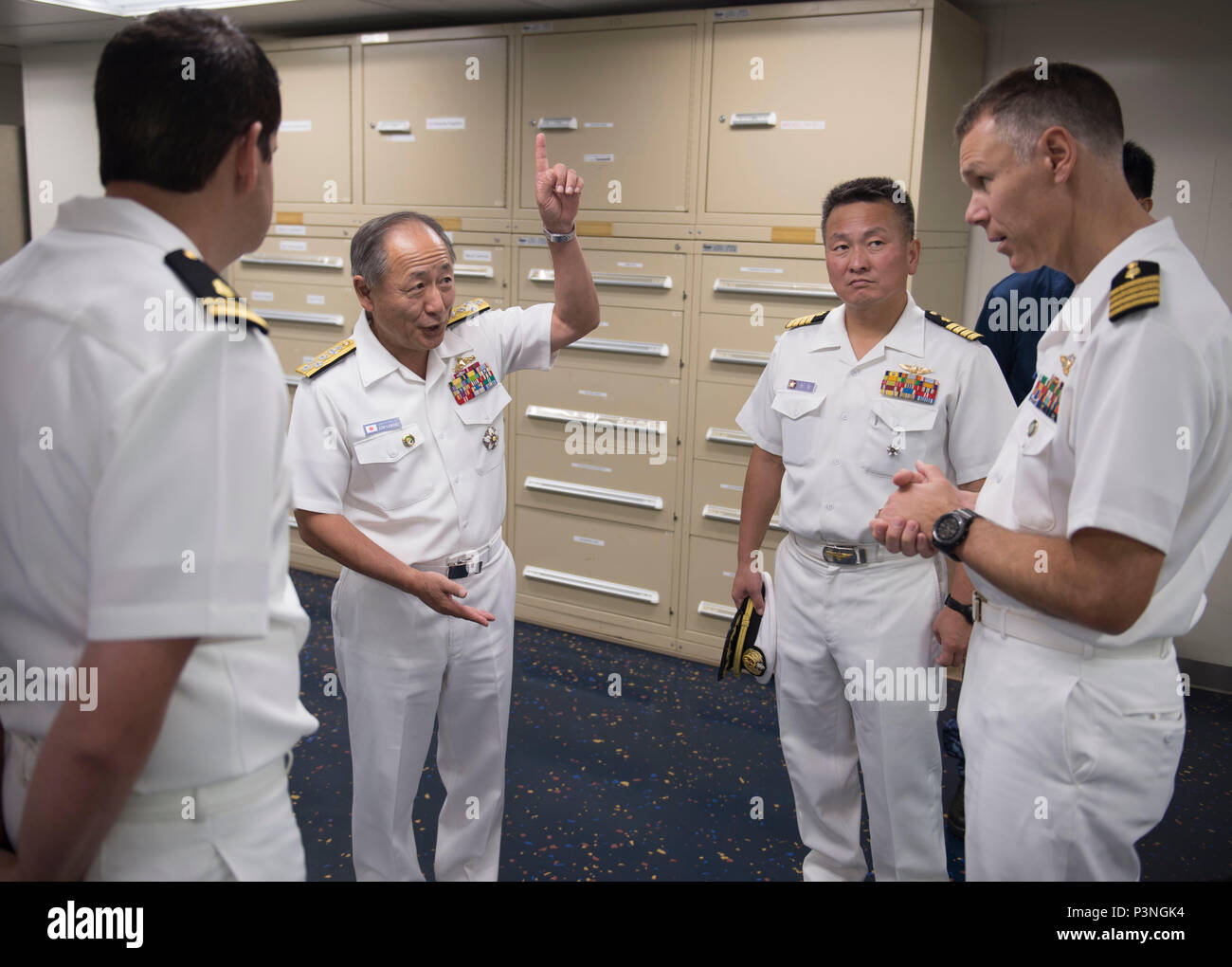 160717-N-QW941-253 DA NANG, Vietnam (July 17, 2016) Admiral Katsutoshi Kawano (second from left), chief of staff of the Joint Staff, Japanese Self-Defense Force, tours hospital ship USNS Mercy (T-AH 19), with Capt. Peter Roberts (right), commanding officer, Medical Treatment Facility, USNS Mercy. Kawano visited Mercy and JS Shimokita (LST-4002), which are both in Da Nang for Pacific Partnership 2016. Partner nations are working side-by-side with local military and non-government organizations to conduct cooperative health engagements, community relation events and subject matter expert exchang Stock Photo