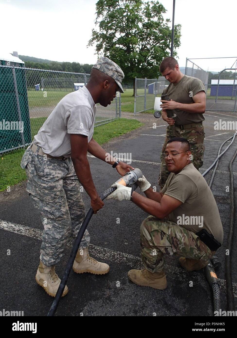 Soldiers from Company A, 48th Combat Support Hospital out of Fort Story, Va., set up electricity for the tents for veterinary services in preparation for Greater Chenango Cares July 14, 2016. Greater Chenango Cares is one of the Innovative Readiness Training missions which provides real-world training in a joint civil-military environment while delivering world-class medical care to the people of Chenango County, N.Y., from July 15-24. Stock Photo