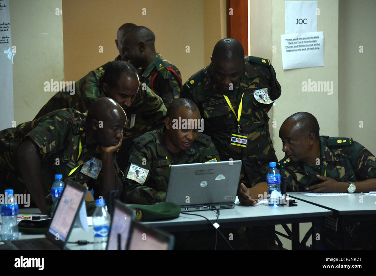 DAR ES SALAAM, Tanzania – Eastern Accord 2016 participants complete the first day’s task for the command post exercise at the Tanzanian Peacekeeping Training Centre, July 19, 2016, in Dar es Salaam, Tanzania. EA16 is an annual, combined, joint military exercise that brings together partner nations to practice and demonstrate proficiency in conducting peacekeeping operations. (U.S. Air Force photo by Staff Sgt. Tiffany DeNault) Stock Photo