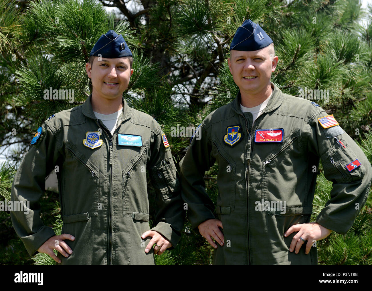 U.S. Air Force Capt. Justin Kellett, C-5 Galaxy pilot and U.S. Air Force  Capt. Kyle Kellett, C-17 Globemaster III pilot, pose for a photo, July 12,  2016 at Altus Air Force Base.