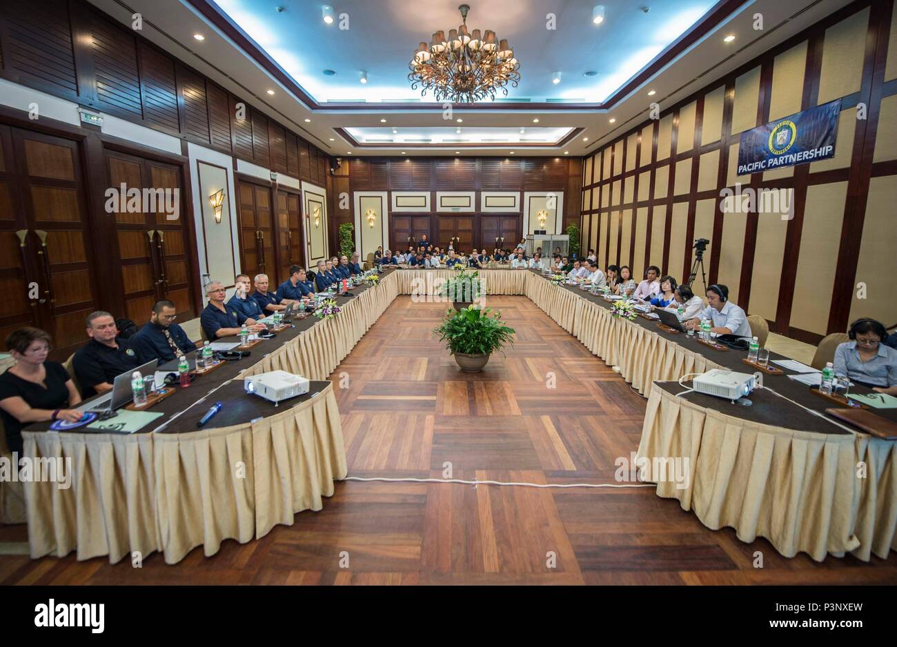 160719-N-QW941-141 DA NANG, Vietnam (July 19, 2016) Pacific Partnership 2016 personnel assigned to USNS Mercy (T-AH 19) sit with Vietnamese government officials and local authorities during a Pacific Partnership 2016 collaborative disaster preparedness and response seminar. During the seminar, participants introduced themselves, shared ideas, real world experiences and possible solutions if a disaster were to strike. Mercy is joined in Da Nang by JS Shimokita (LST-4002) and Vietnam People's Navy ship Khánh Hóa for Pacific Partnership. Partner nations will work side-by-side with local organizat Stock Photo