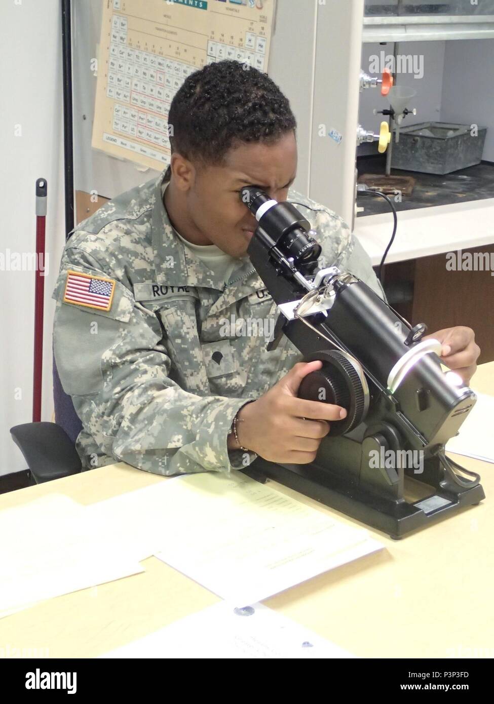 Spc. Trayon  Royal from Company A, 48th Combat Support Hospital out of Fort Story, Va., checks a patient’s eyeglass prescription during Greater Chenango Cares, July 22, 2016.  Greater Chenango Cares is one of the Innovative Readiness Training events which provides real-world training in a joint civil-military environment while delivering world-class medical care to the people of Chenango County, N.Y., from July 15-24. Stock Photo