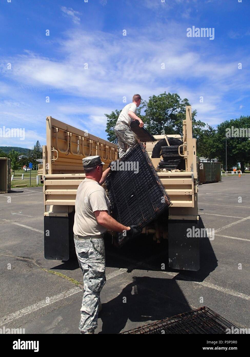 Service members from Company A, 48th Combat Support Hospital out of Fort Story, Va., helps pack up the veterinary section of the Greater Chenango Cares Innovative Readiness Training event, July 24, 2016.  Greater Chenango Cares is one of the IRT events which provides real-world training in a joint civil-military environment while delivering world-class medical care to the people of Chenango County, N.Y., from July 15-24. Stock Photo