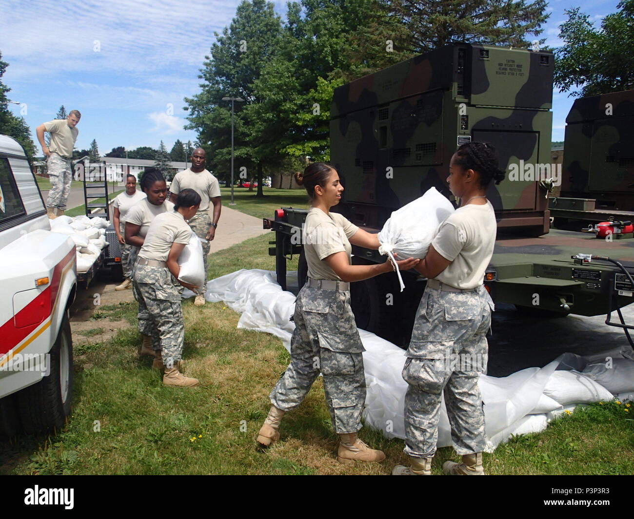 Soldiers from Company A, 48th Combat Support Hospital out of Fort Story, Va., remove sandbags during the pack up of the Greater Chenango Cares Innovative Readiness Training event, July 24, 2016. Greater Chenango Cares is one of the IRT events which provides real-world training in a joint civil-military environment while delivering world-class medical care to the people of Chenango County, N.Y., from July 15-24. Stock Photo