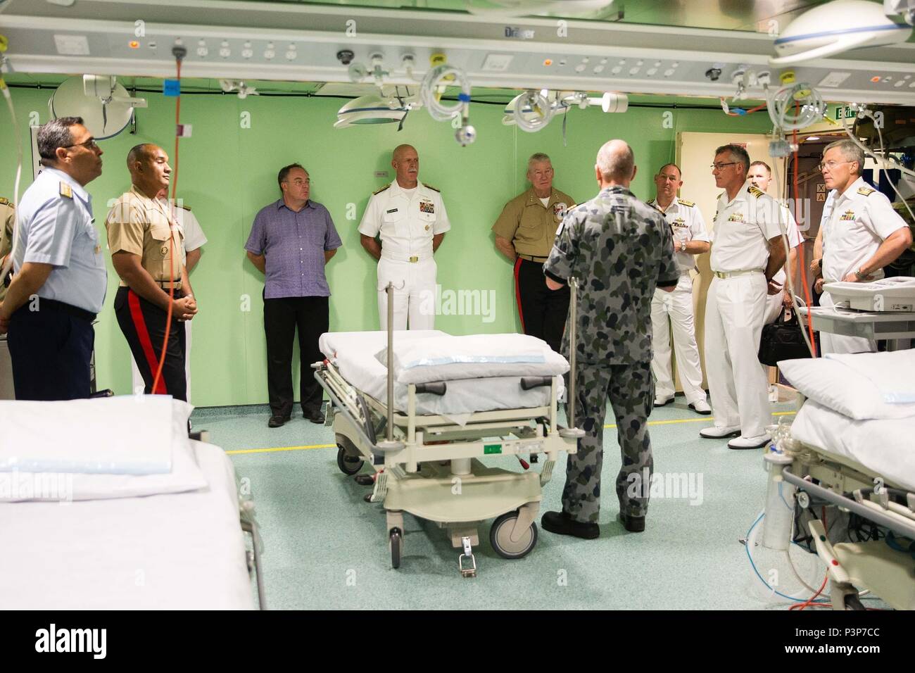 Senior officers from the US Armed Forces are given a tour of HMAS