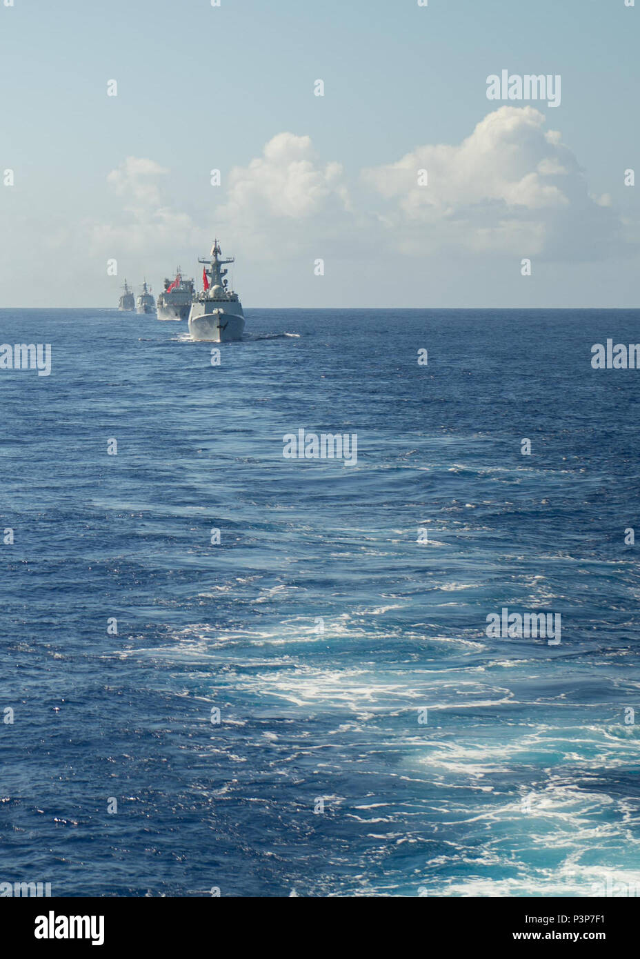 160718-N-KM939-111:  PACIFIC OCEAN (July 18, 2016) - Chinese navy ships steam in formation behind the guided-missile destroyer USS Stockdale (DDG 106) during a tactical maneuver exercise for Rim of the Pacific 2016. Twenty-six nations, 40 ships and submarines, more than 200 aircraft and 25,000 personnel are participating in RIMPAC from June 30 to Aug. 4, in and around the Hawaiian Islands and Southern California. The world's largest international maritime exercise, RIMPAC provides a unique training opportunity that helps participants foster and sustain the cooperative relationships that are cr Stock Photo