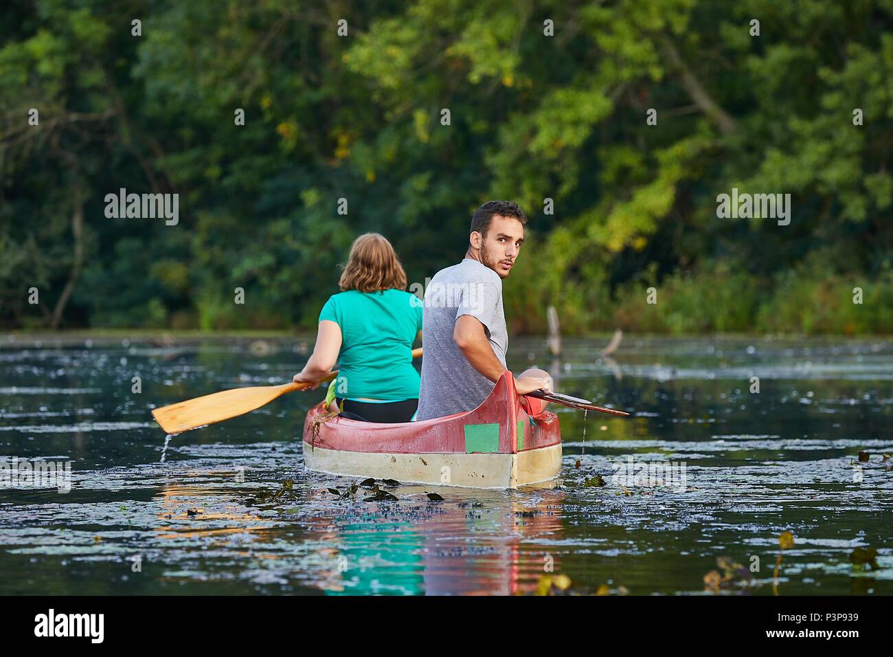 Couple rowing canoe on calm hi-res stock photography and images - Alamy