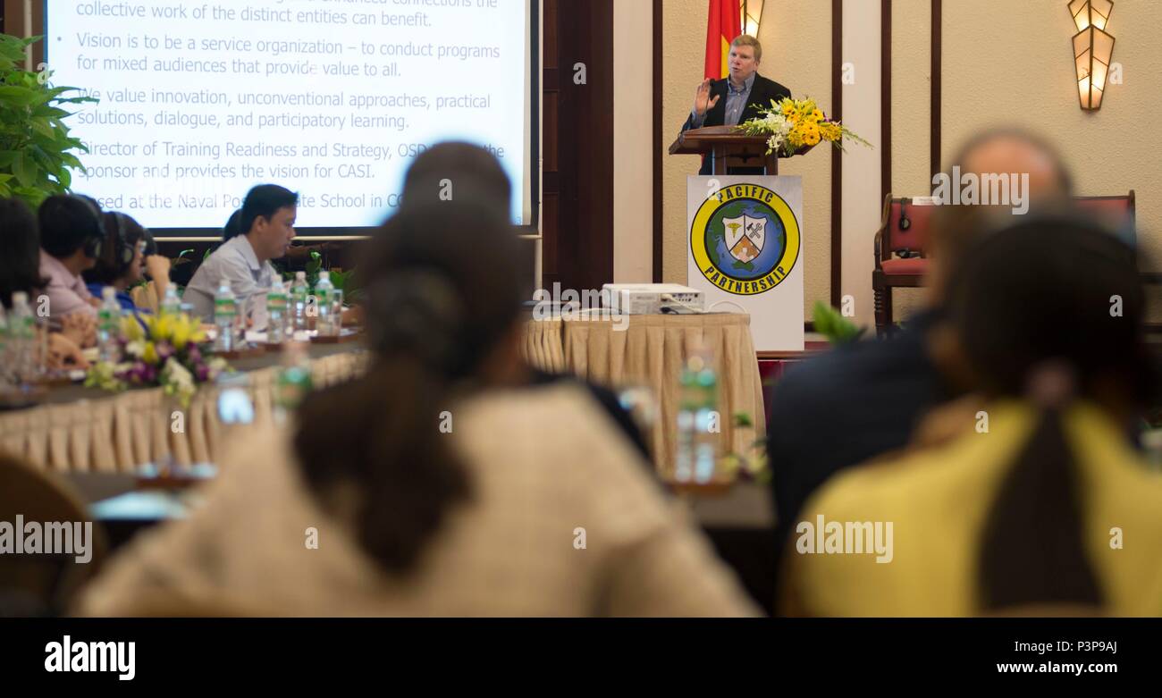 160719-N-QW941-106 DA NANG, Vietnam (July 19, 2016)  Collaborative and Adaptive Security Initiative program manager, Matthew Vaccaro (center), addresses Pacific Partnership 2016 personnel assigned to USNS Mercy (T-AH 19), Vietnamese government officials and local authorities during a Pacific Partnership 2016 collaborative disaster preparedness and response seminar. During the seminar, participants introduced themselves, shared ideas, real world experiences and possible solutions if a disaster were to strike. Mercy is joined in Da Nang by JS Shimokita (LST-4002) and Vietnam People's Navy ship K Stock Photo
