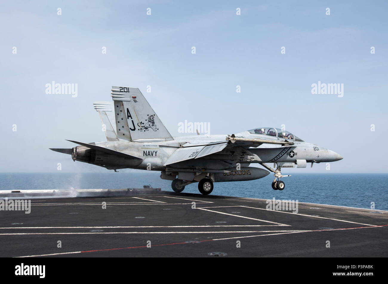 ARABIAN GULF (May 7, 2017) Capt. James McCall III, commander, Carrier Air Wing 8, and Cmdr. Kevin Robb, commanding officer of the 'Blacklions' of Strike Fighter Squadron (VFA) 213, launch from the aircraft carrier USS George H.W. Bush (CVN 77) in an F/A-18F Super Hornet. The ship is deployed to the U.S. 5th Fleet area of operations in support of maritime security operations designed to reassure allies and partners, and preserve the freedom of navigation and the free flow of commerce in the region. Stock Photo