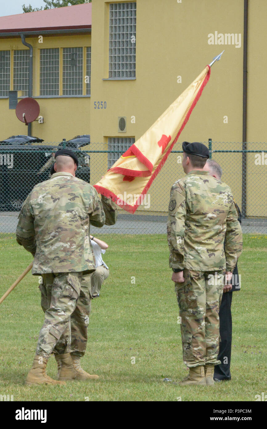 ANSBACH, Germany (July 21, 2016) – From left, Command Sgt. Maj. Derek R. Cuvellier, U.S. Army Garrison Ansbach command sergeant major; Col. Christopher M. Benson, outgoing commander of USAG Ansbach; Col. Benjamin C. Jones, incoming commander of USAG Ansbach; and Michael D. Formica, Installation Management Command – Europe director, prepare to pass the USAG Ansbach guidon, signifying the change of command. U.S. Army Garrison Ansbach said farewell to commander Benson and welcomed commander Jones during a ceremony Monday on the Barton Barracks athletic field here. Stock Photo