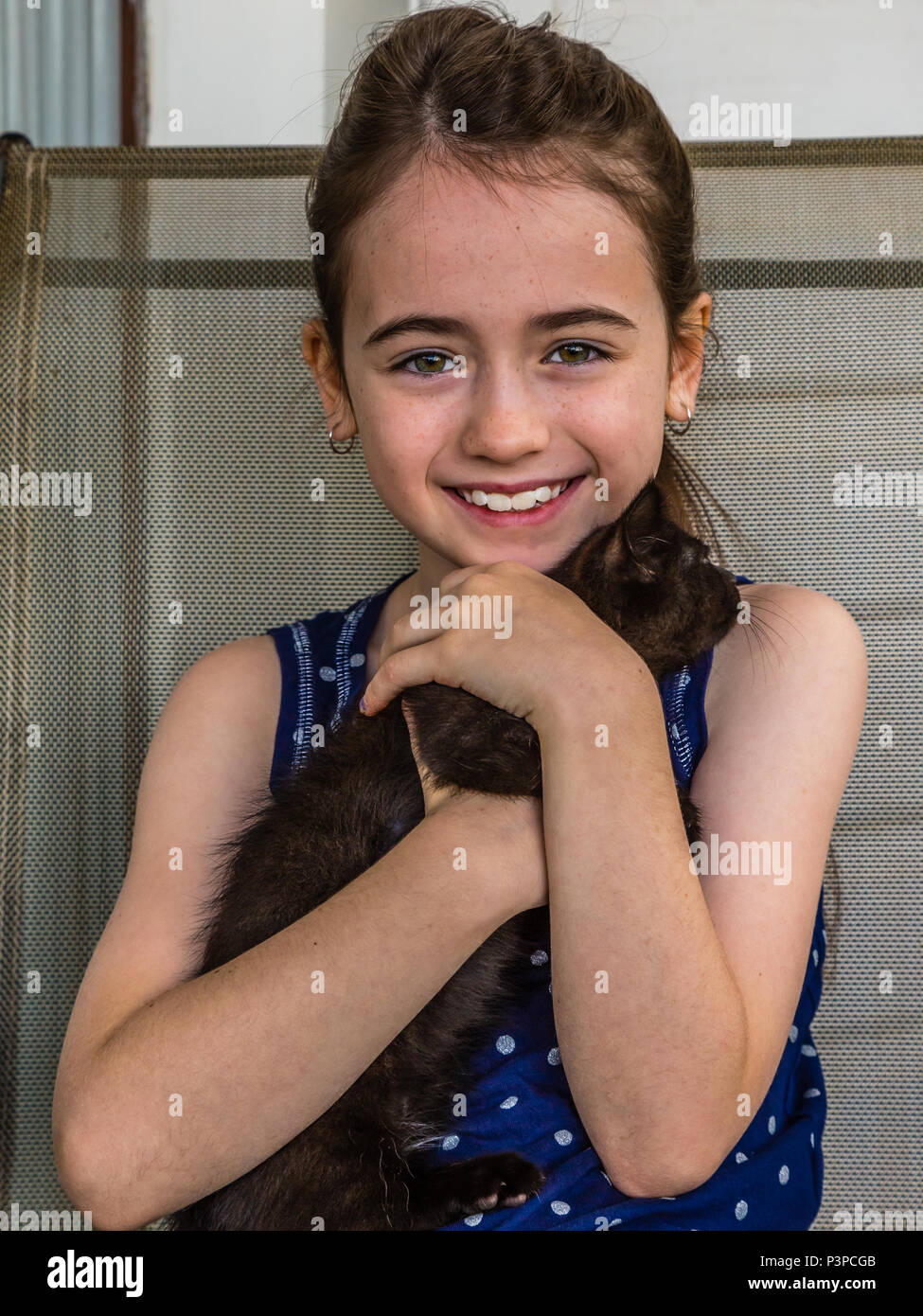 Portrait of a young girl with her cat. Stock Photo