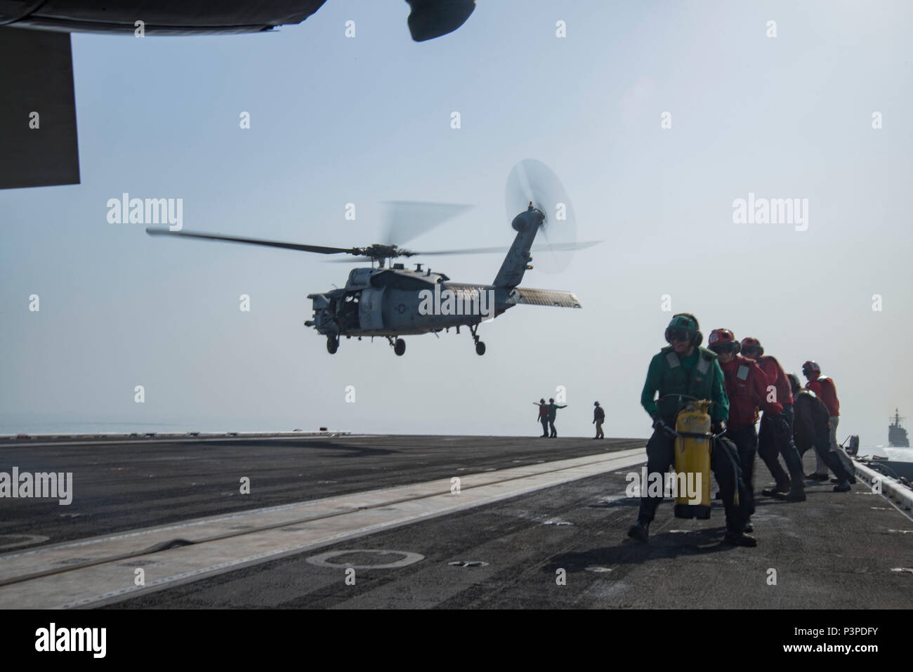 160721-N-QI061-434 STRAIT OF HORMUZ (July 21, 2016) – Sailors brace ...
