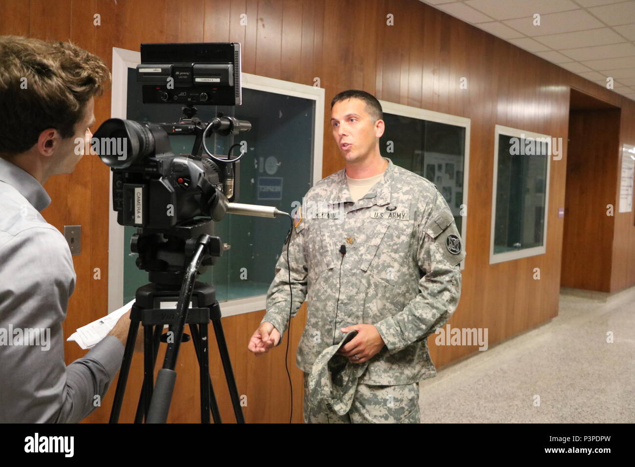 Maj. Jeremy McKenna of Alpha Company 48th Combat Support Hospital, Fort Story Va., gives an interview with local media about the Greater Chenango Cares Innovative Readiness Training event, July 17, 2016. Greater Chenango Cares is one of the IRT events that provides real-world training in a joint civil-military environment while delivering world class medical care to the people of Chenango County, N.Y., from July 15-24. Stock Photo