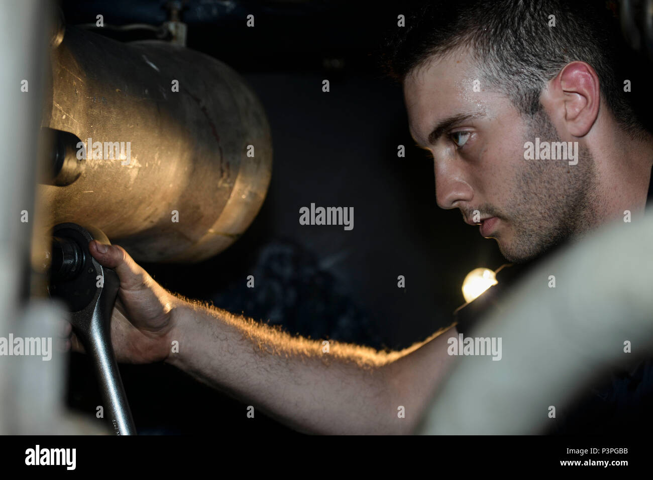 NAVAL BASE KITSAP-BREMERTON, Wash. (July 21, 2016) – Airman Michael Kirby, a native of Smithsburg, Md., repacks a launch valve on board the aircraft carrier USS Nimitz (CVN 68). Nimitz is currently undergoing an extended planned incremental maintenance availability at Puget Sound Naval Shipyard and Intermediate Maintenance Facility, where the ship is receiving scheduled maintenance and upgrades. (U.S. Navy photo by Mass Communication Specialist Seaman Apprentice Emily Johnston/Released) Stock Photo