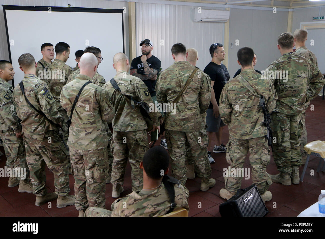 Mat Best, left, CEO of Article 15 Clothing and Army Ranger veteran, and  Nick Palmisciano, founder of Ranger Up clothing company and Army veteran,  talk with a group of Combined Joint Forces