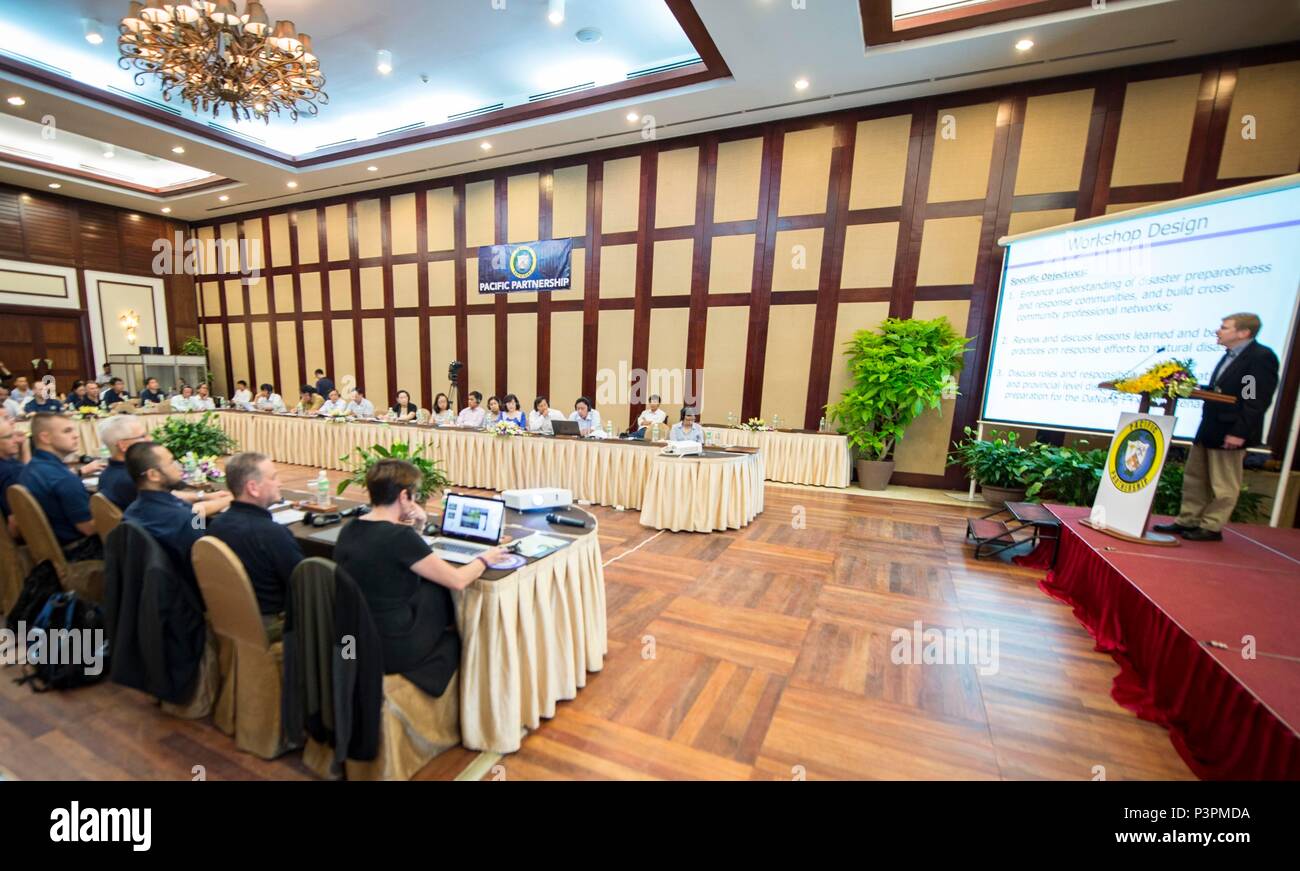 160719-N-QW941-127 DA NANG, Vietnam (July 19, 2016)  Collaborative and Adaptive Security Initiative program manager, Matthew Vaccaro (right), addresses Pacific Partnership 2016 personnel assigned to USNS Mercy (T-AH 19), Vietnamese government officials and local authorities during a Pacific Partnership 2016 collaborative disaster preparedness and response seminar. During the seminar, participants introduced themselves, shared ideas, real world experiences and possible solutions if a disaster were to strike. Mercy is joined in Da Nang by JS Shimokita (LST-4002) and Vietnam People's Navy ship Kh Stock Photo