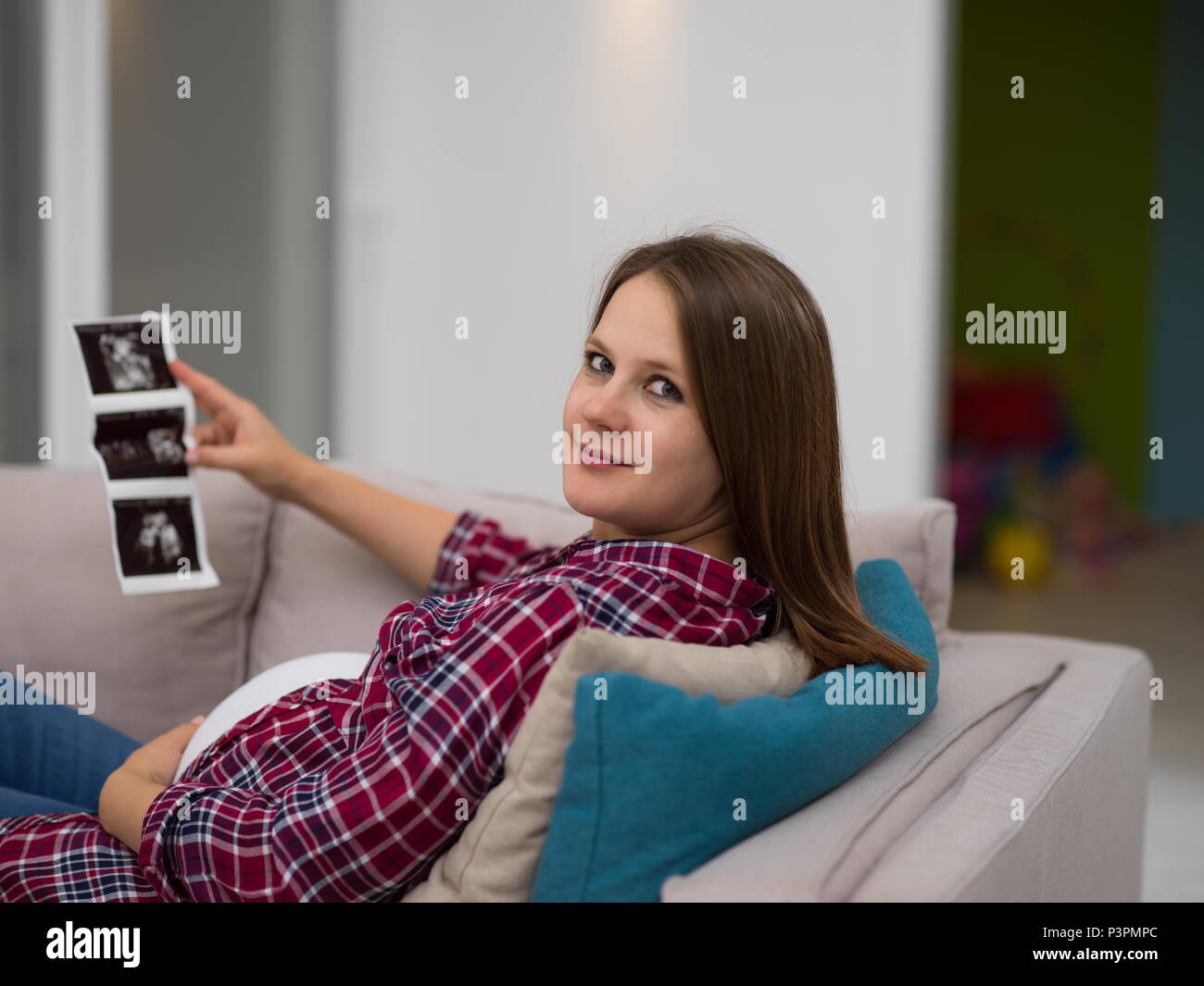 Young Pregnant Woman Looking Baby S Ultrasound Photo While