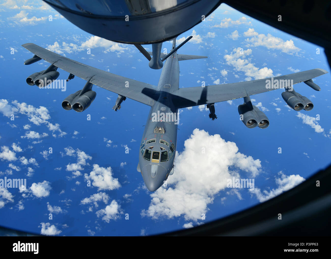 A B-52H Stratofortress from the 69th Bomb Squadron, Minot Air Force Base, N.D., prepares to receive fuel from a KC-135 Stratotanker over the Pacific Ocean during an international sinking exercise for Rim of the Pacific 2016 near Joint Base Pearl Harbor-Hickam, July 14, 2016. Twenty-six nations, more than 40 ships and submarines, more than 200 aircraft, and 25,000 personnel are participating in RIMPAC from June 30 to Aug. 4 in and around the Hawaiian Islands and Southern California. The world's largest international maritime exercise, RIMPAC, provides a unique training opportunity that helps pa Stock Photo