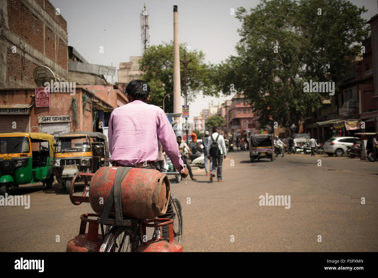 Men, street, gas, India Stock Photo
