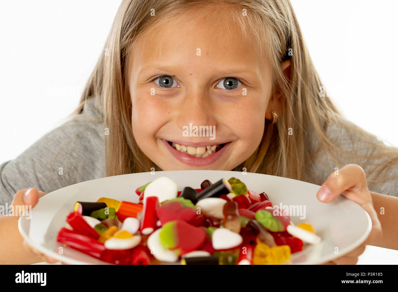 pretty happy sugar high caucasian female child eating dish full of