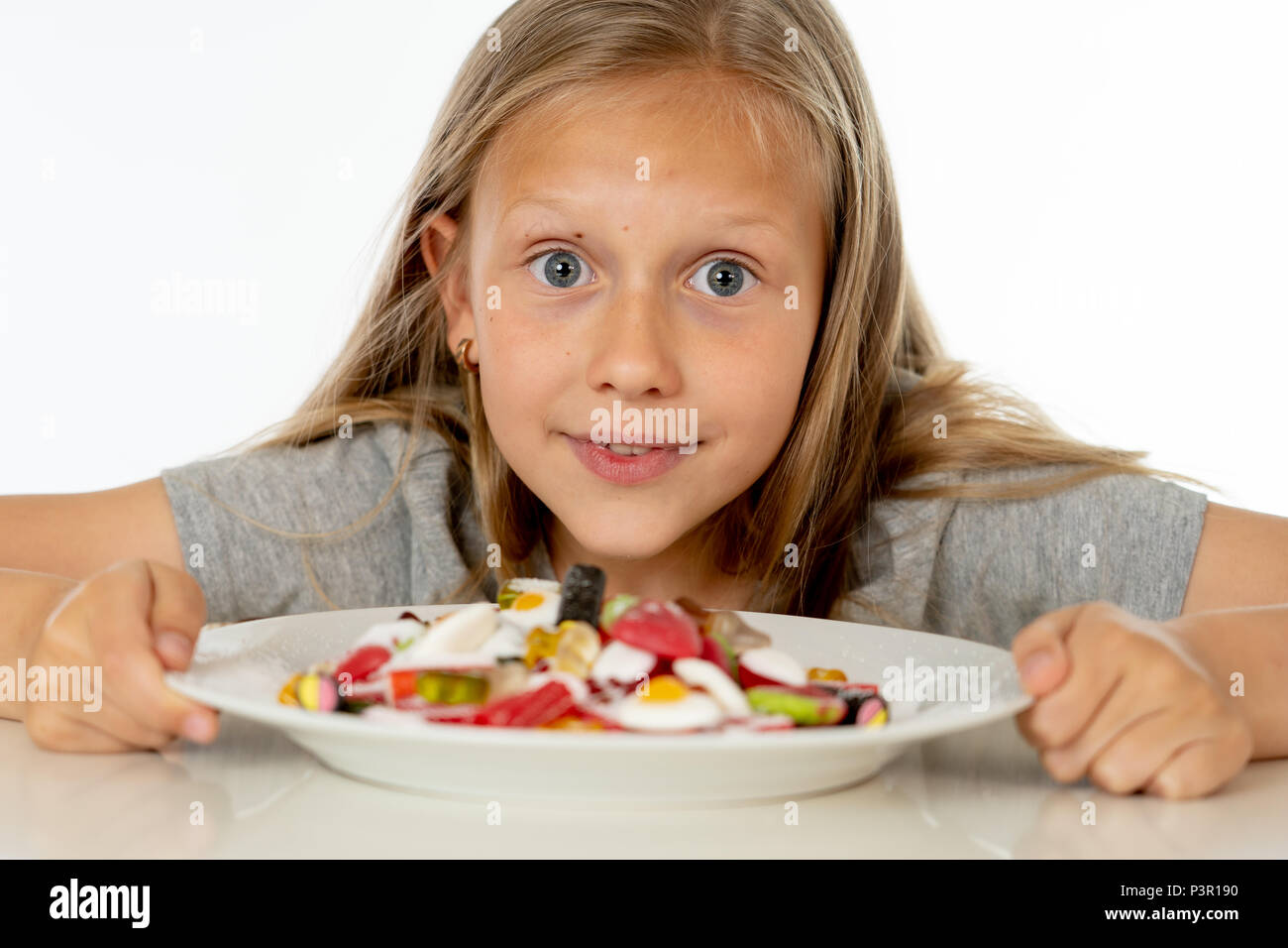 pretty happy sugar high caucasian female child eating dish full of