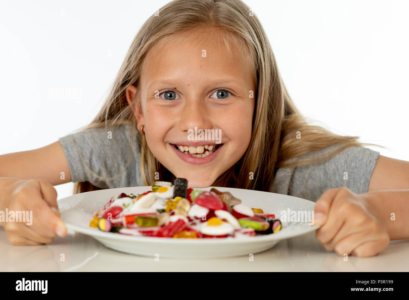 pretty happy sugar high caucasian female child eating dish full of