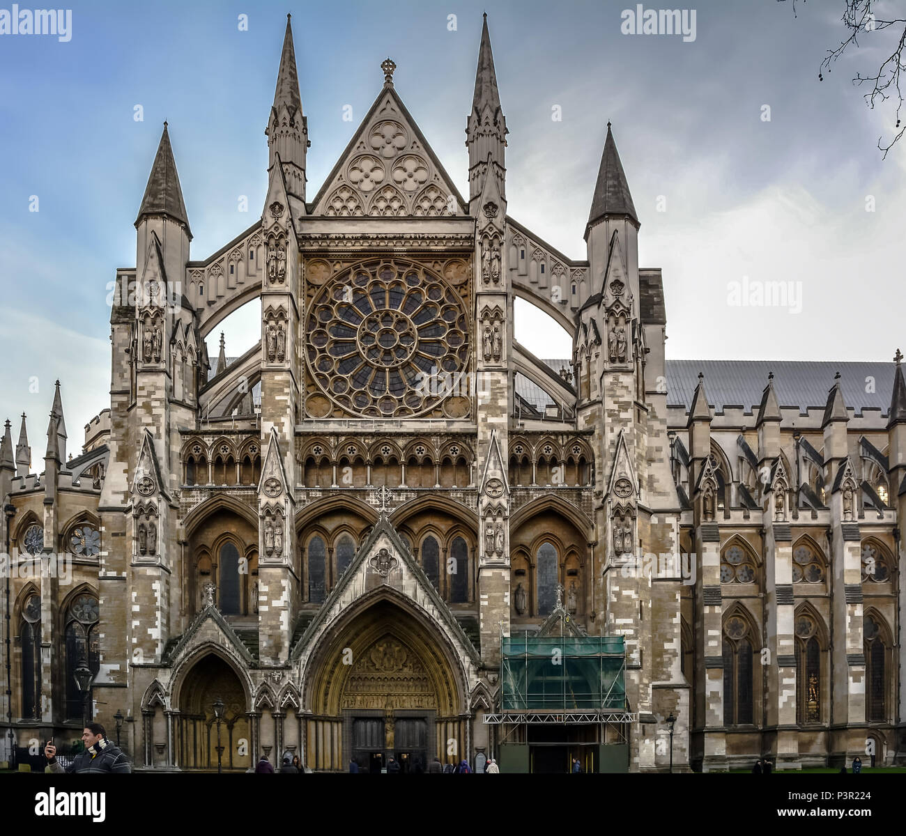 Exterior view of the North Transept of Westminster Abbey, entrance with three doorways. Gothic arches, large rose wind Stock Photo