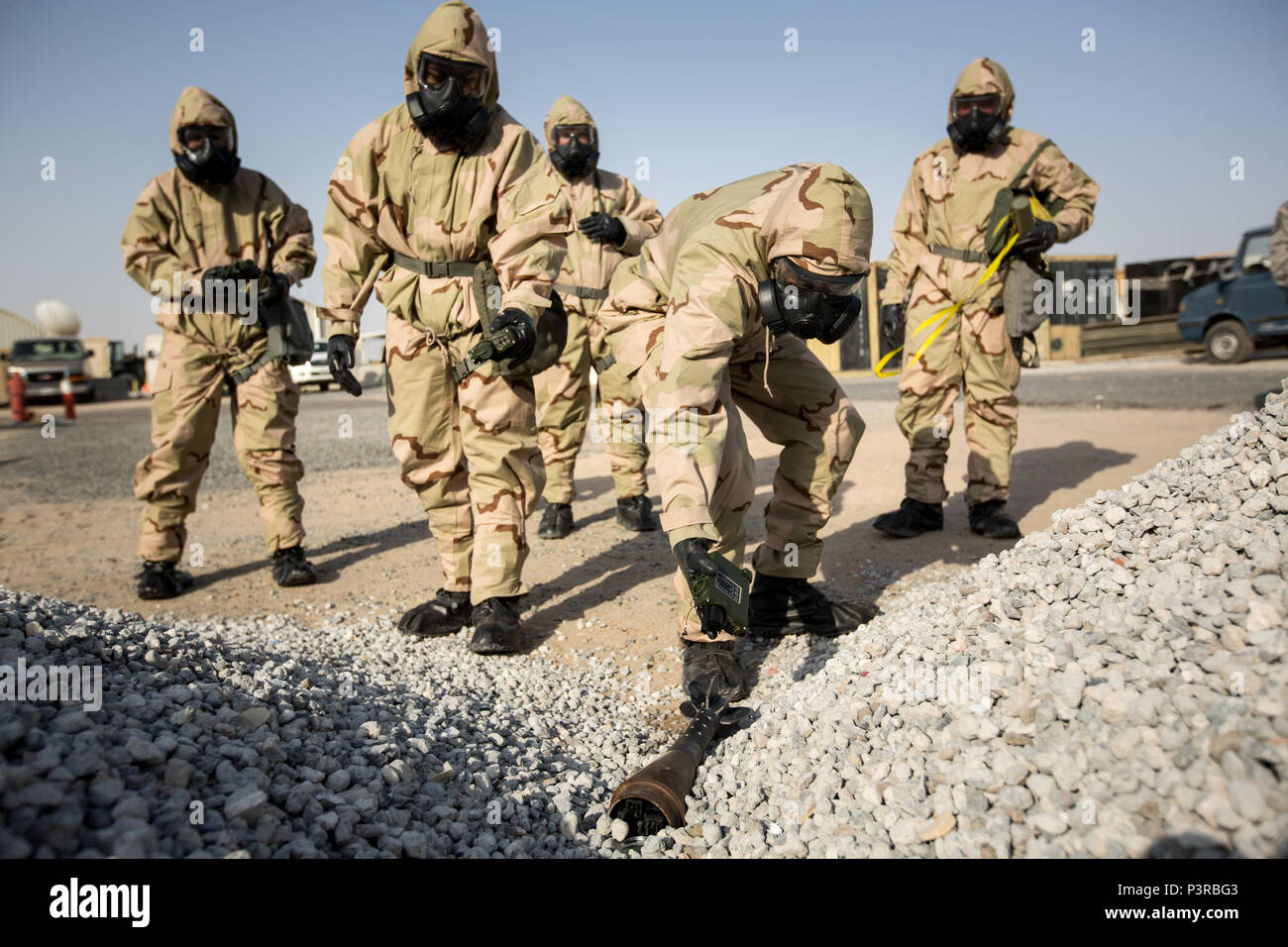 U.S. Marines with Special Purpose Marine Air-Ground Task Force - Crisis Response - Central Command, examine a simulated hazardous threat with Joint Chemical Agent Detectors during a Reconnaissance, Surveillance and Decontamination course run by Chemical, Biological, Radiological and Nuclear Defense Marines while forward deployed, July 16, 2016. SPMAGTF-CR-CC is a crisis response unit that has the ability to project combat power throughout the Central Command area of responsibility, using organic aviation, logistical, and ground combat assets. (U.S. Marine Corps photo by Cpl. Trever Statz/Relea Stock Photo