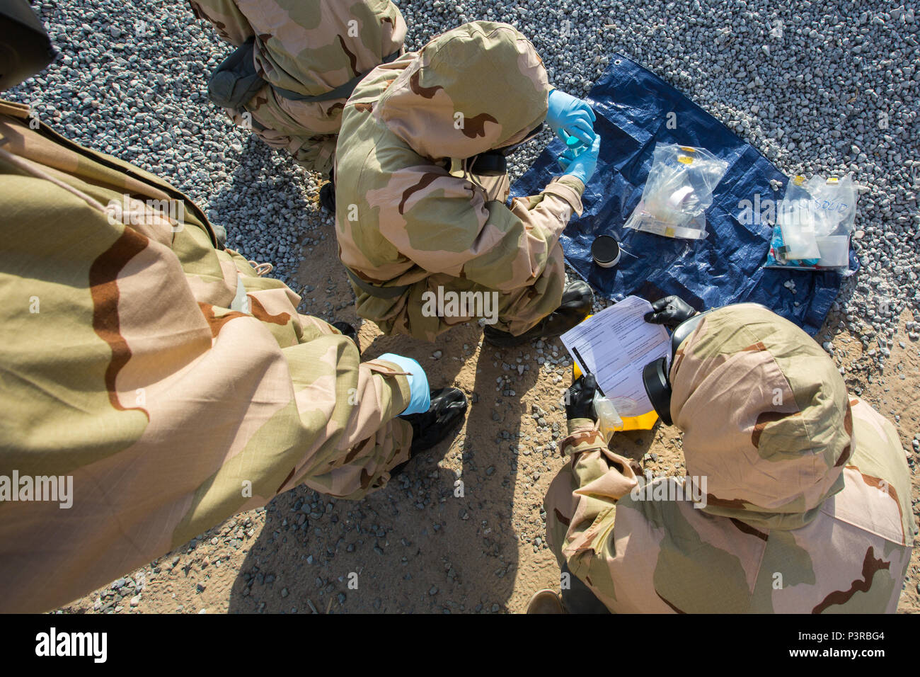 U.S. Marines with Special Purpose Marine Air-Ground Task Force - Crisis Response - Central Command, seal simulated hazardous material sample during a Reconnaissance, Surveillance and Decontamination course run by Chemical, Biological, Radiological and Nuclear Defense Marines while forward deployed, July 16, 2016. SPMAGTF-CR-CC is a crisis response unit that has the ability to project combat power throughout the Central Command area of responsibility, using organic aviation, logistical, and ground combat assets. (U.S. Marine Corps photo by Cpl. Trever Statz/Released) Stock Photo