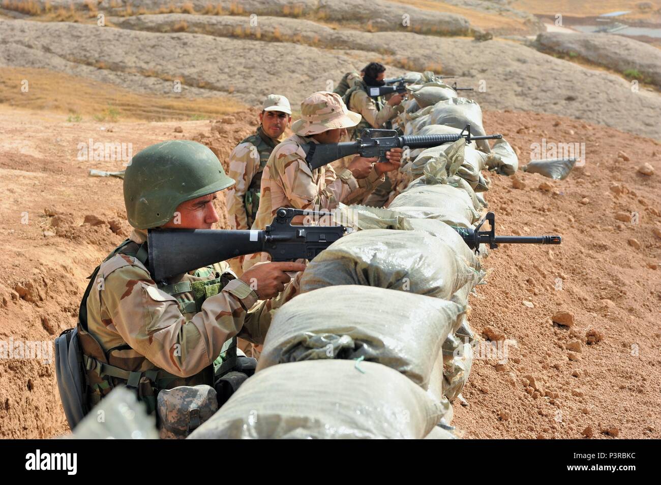 Peshmerga soldiers prepare for an anticipated attack along simulated ...