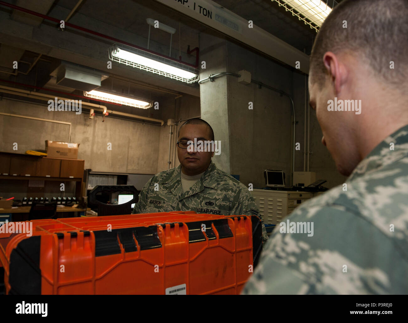 U.S. Air Force Staff Sgt. Louis Guadron, 82nd Reconnaissance Squadron aerospace  propulsion systems technician, is given an inspection out-brief by Tech.  Sgt. Matthew Morrison, 82nd RS quality assurance chief inspector, July 18,