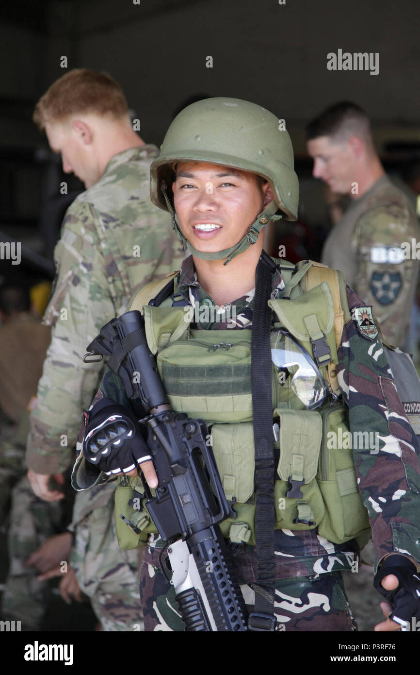 A Philippine Soldier prepares to train with U.S. Soldiers with the 1-2  Stryker Brigade Combat Team during a hostage rescue scenario in support of  Balikatan 2017 at Fort Ramon Magsaysay, Nueva Ecija,