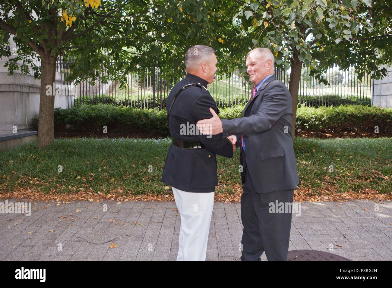 U.S. Marine Corps Maj. Gen. John Ewers, left, staff judge advocate to