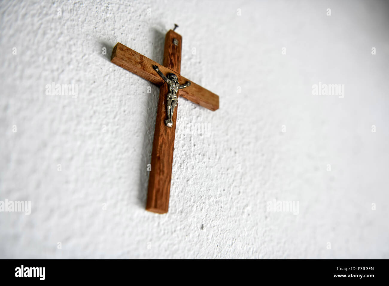 Cross hangs on the wall, Kreuz hängt an der Wand Stock Photo