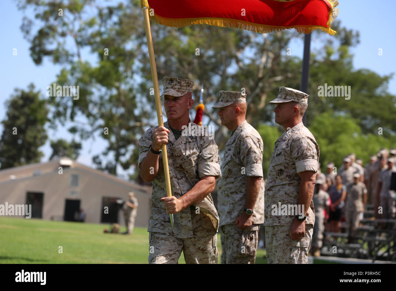 Sgt. Maj. Bradley Kasal, the sergeant major of I Marine Expeditionary Force, marches with the colors during a change of command ceremony at Camp Pendleton July 27, 2016. During the ceremony, Berger relinquished his duties as the commanding general of I MEF to Craparotta. (U.S. Marine Corps photo by Cpl. Garrett White/ RELEASED) Stock Photo