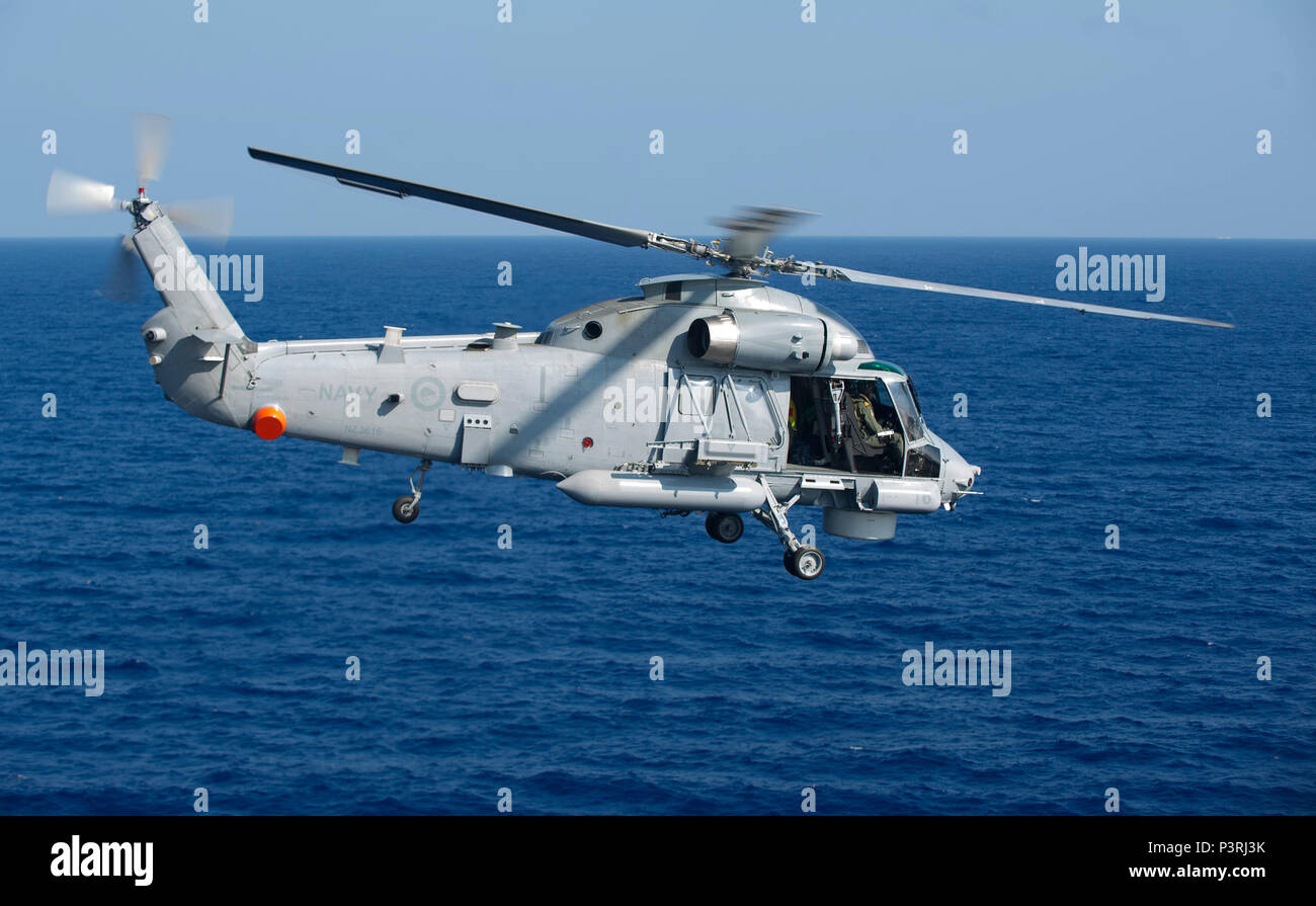 160725-N-LD343-004 PACIFIC OCEAN (July 25, 2016) – A Royal New Zealand Navy SH-2G Seasprite helicopter flies over the Pacific Ocean after departing the amphibious assault ship USS America (LHA 6). America is underway conducting maritime exercises with partner nations for Rim of the Pacific 2016. Twenty-six nations, more than 40 ships and submarines, more than 200 aircraft and 25,000 personnel are participating in RIMPAC from June 30 to Aug. 4, in and around the Hawaiian Islands and Southern California. The world's largest international maritime exercise, RIMPAC provides a unique training oppor Stock Photo