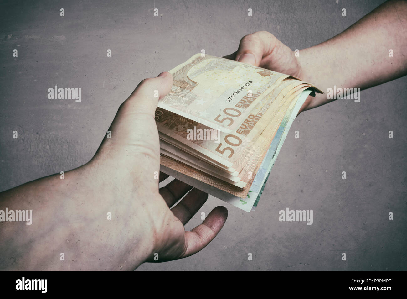Money Loan. Bank officer loaning stack of euro banknotes money,  loan, bribery and corruption concepts Stock Photo