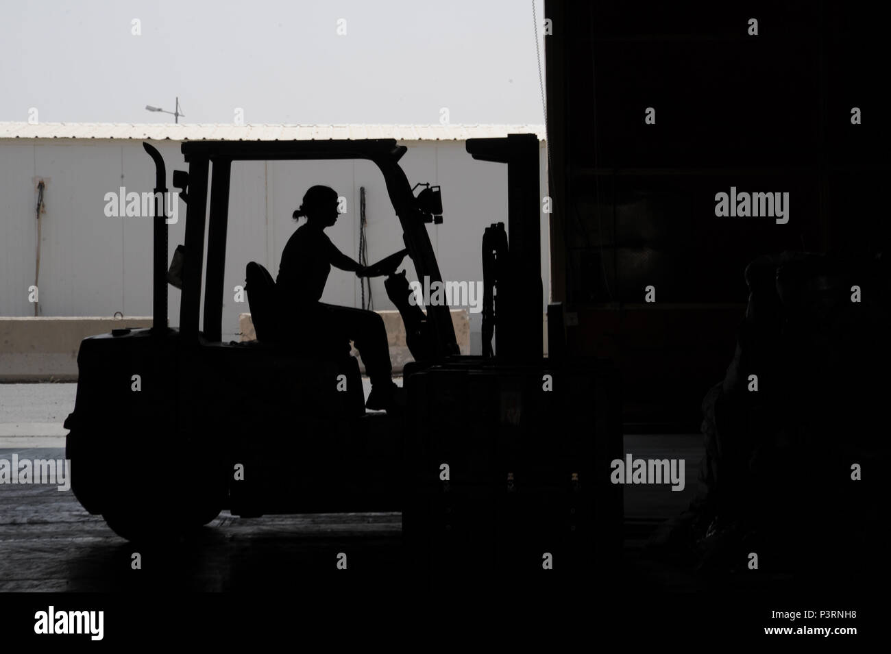 An Airman from the 386th Expeditionary Logistics Readiness Squadron aerial port flight operates a forklift July 21, 2016 at an undisclosed location in Southwest Asia. The 386 ELRS is home to the busiest aerial port in Southwest Asia. (U.S. Air Force photo/Senior Airman Zachary Kee) Stock Photo