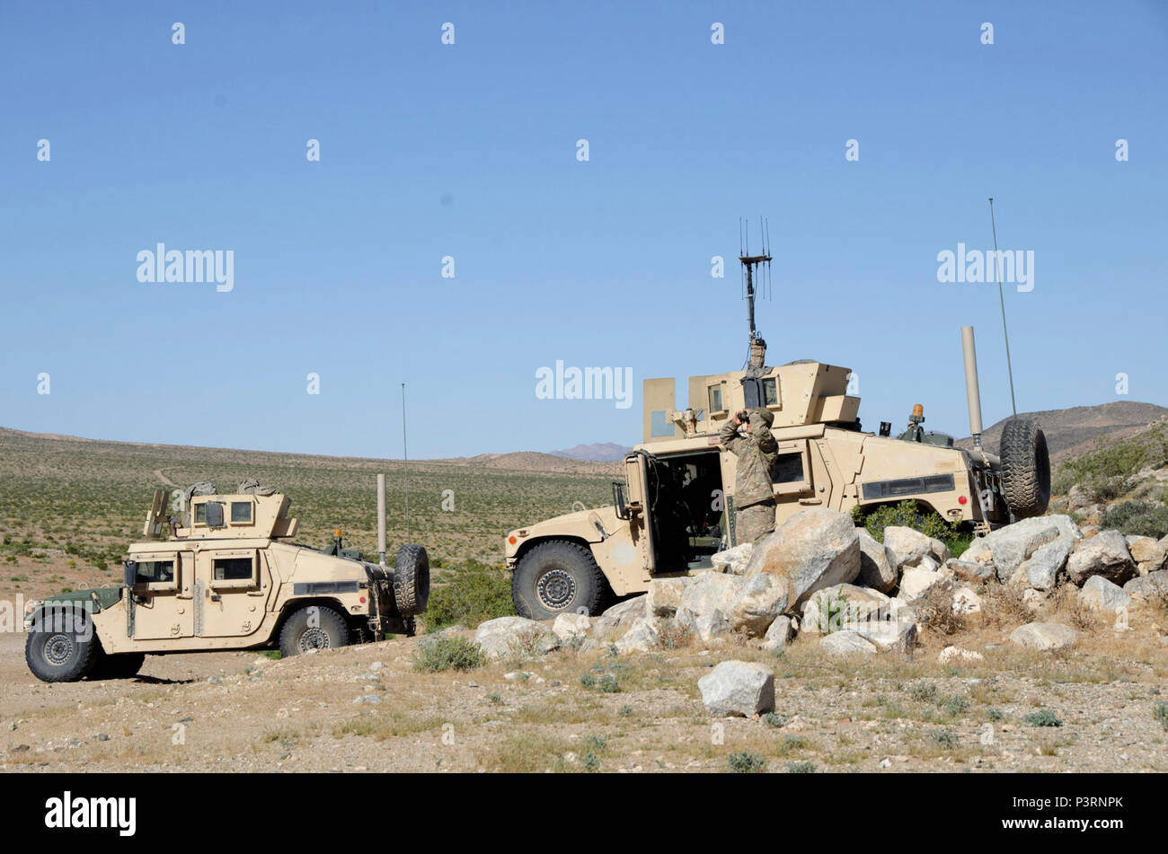 An Expeditionary Cyber-Electromagnetic Activities Team member surveys ...