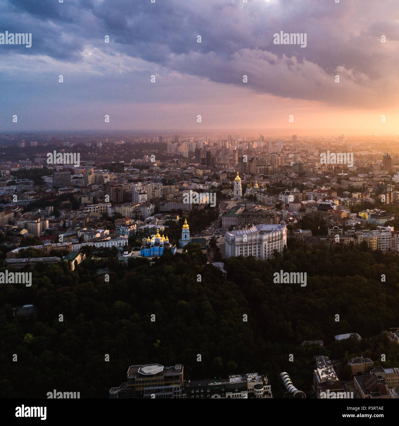 Panoramic view of a modern city at sunset. Skyline bird eye aerial view ...