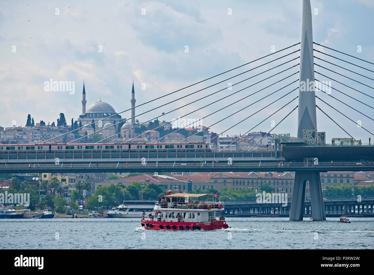 ISTANBUL, TURKEY - MAY 26 : Boat cruising up the Bosphorus in Istanbul ...