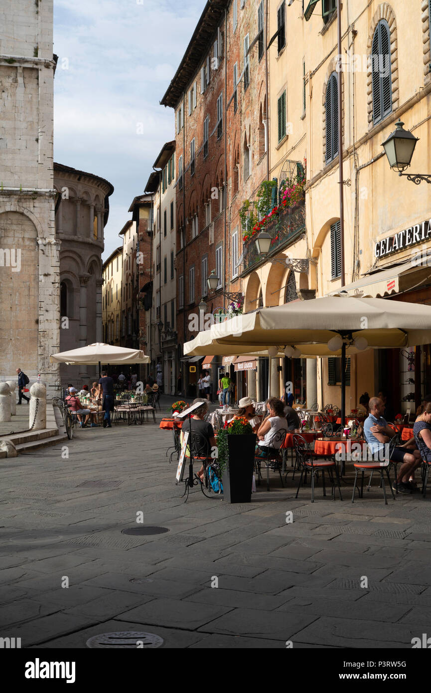 Street scene behind San Michele in Foro showing cafe's. Stock Photo