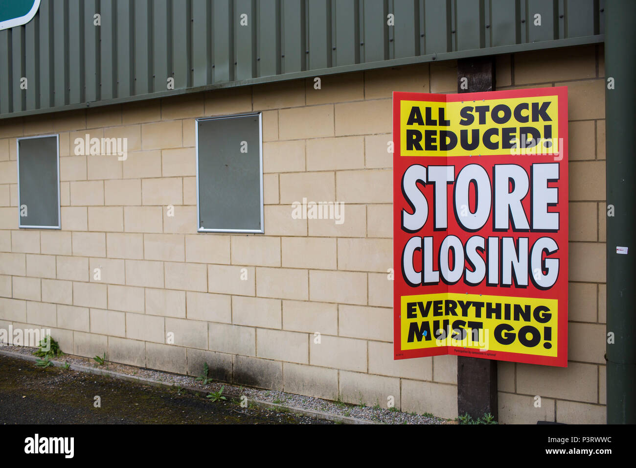 Closing down signs in the windows of a large shop in the UK Stock Photo Closing down signs in the windows of a large shop in the UK Stock Photo