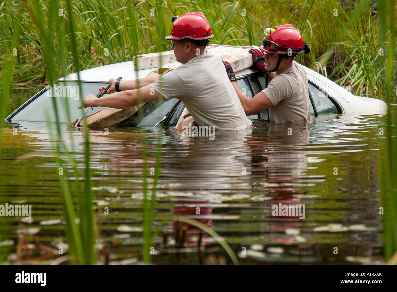 U.S. Senior Airman John Gasque, left, and Airman 1st Class Reneau ...