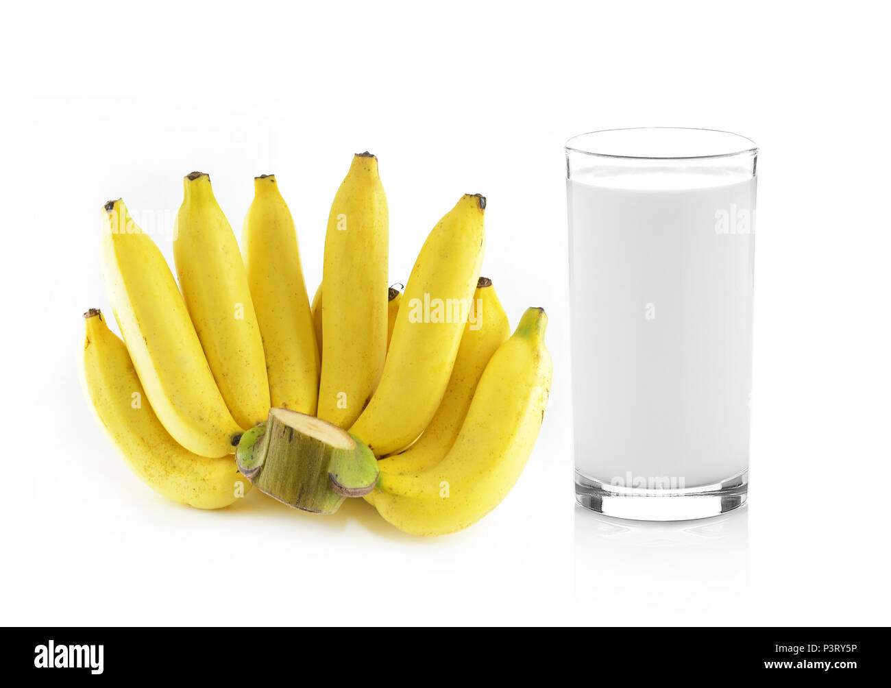 Glass of milk with banana over white background Stock Photo - Alamy