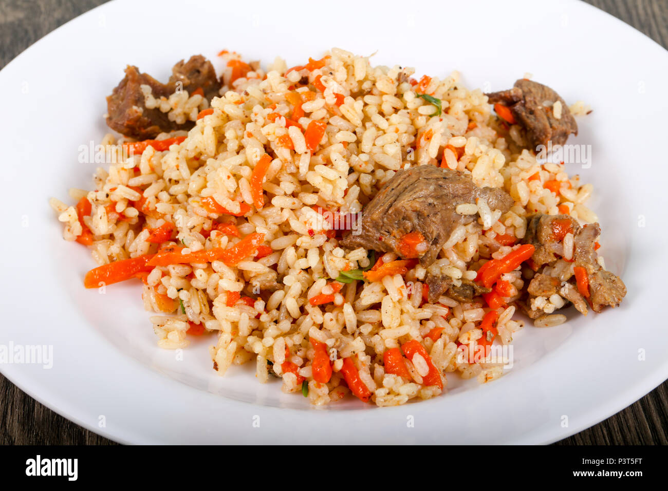 Asian rice - Plov with meat and carrot Stock Photo - Alamy