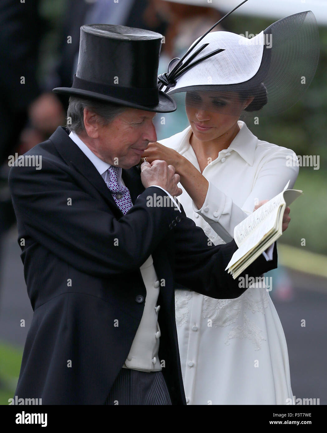 Horse Manager John Warren (left) and the Duchess of Sussex during day one of Royal Ascot at Ascot Racecourse. Stock Photo