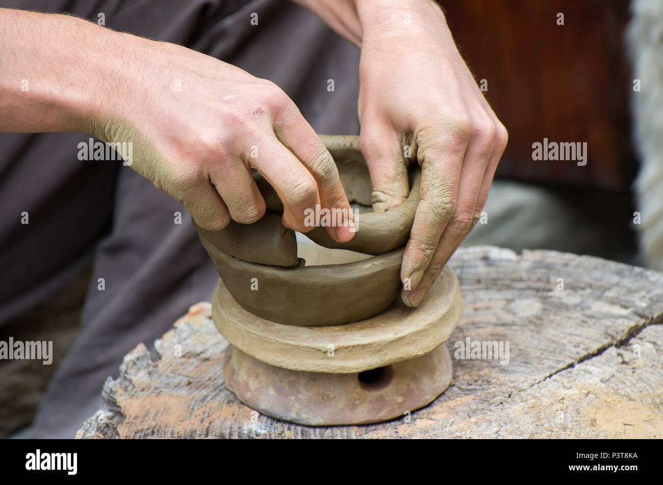 Creating a jar or vase of white clay close-up. Stock Photo